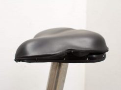 Stylish black bicycle saddle with ergonomic support and visible wear, perfect for modern cycling.