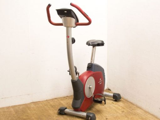 Sleek gray and red stationary exercise bike with adjustable features for comfortable workouts.