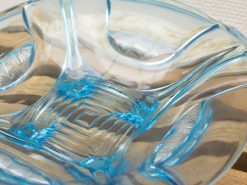 Vibrant blue and clear glass bowl, perfect for decor or serving snacks and fruit.