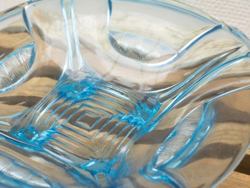 Vibrant blue and clear glass bowl, perfect for decor or serving snacks and fruit.