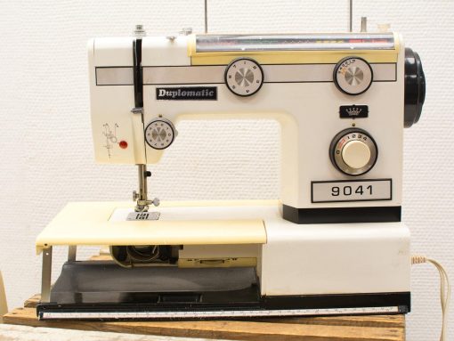 Vintage Duplomatic 9041 sewing machine with elegant design and versatile features for creative projects.