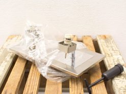 Vintage hardware components for installation, featuring metal base and accessories for enthusiasts.