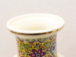 Vibrant hand-painted ceramic vase with floral design and elegant gold rim, perfect for decor.