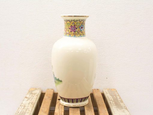 Elegant hand-painted Chinese vase with vibrant floral motifs and a glossy finish.