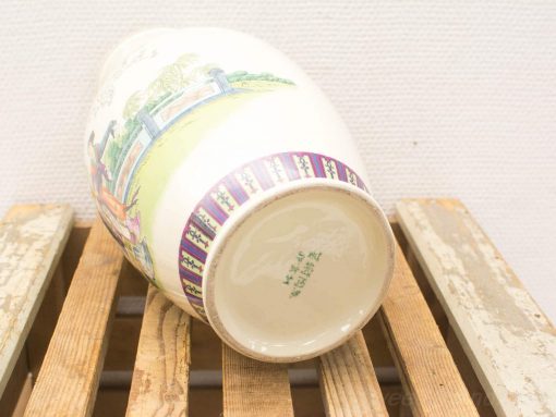 Hand-painted Chinese porcelain vase featuring vibrant landscapes and traditional figures, a unique art piece.