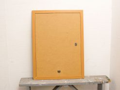 Elegant vintage frame with wooden border and cardboard backing, perfect for art or photos.