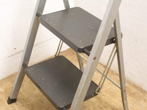 Durable metal step ladder for home and garden projects, featuring non-slip steps and reliable support.