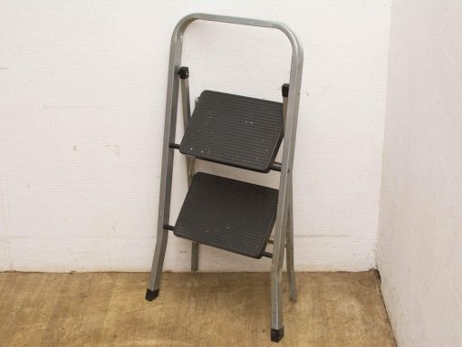 Lightweight two-step folding ladder for home and workshop use, ensuring safety and stability.
