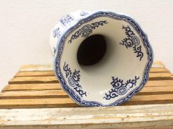 Elegant vintage ceramic vase with intricate blue patterns on a white background.
