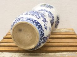 Elegant blue and white porcelain vase with floral motifs, showcasing exquisite craftsmanship and design.
