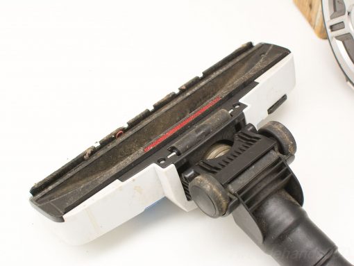 Used Koenic vacuum head with wheels and brushes for efficient floor and carpet cleaning.