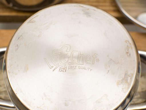 Stainless steel Le Chef pot with quality design and signs of use, perfect for cooking.