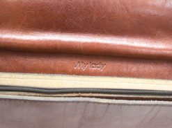 Elegant cognac leather shoulder bag with personalized My Lady inscription and refined detailing.