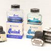 Vintage Parker and Pelikan ink bottles, ideal for collectors and writing enthusiasts.