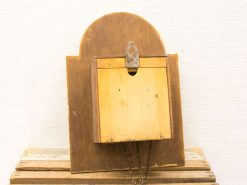 Antique wooden mail collection box with unique design and secure metal latch.