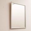 Sleek modern mirror with rounded edges, enhancing minimalist decor and inviting creative reflection.