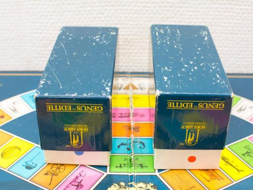 Vintage Genus S. Editi board game set with colorful game board and elegant blue boxes.