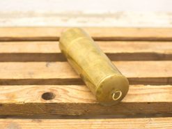 Elegant brass cylinder with subtle engravings, perfect for decoration or as a unique collectible.