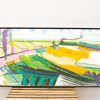 Vibrant landscape painting of colorful fields and whimsical trees, capturing joyful rural life.