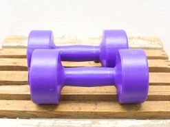Purple 5 lbs dumbbells for stylish and functional workouts; perfect vintage fitness accessories.