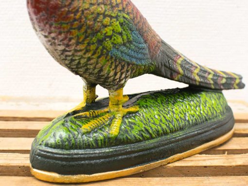 Vibrant cast iron bird figurine, perfect for garden decoration and charming home collections.