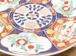 Stunning Japanese Imari ceramic plate with vibrant floral pattern and intricate design.