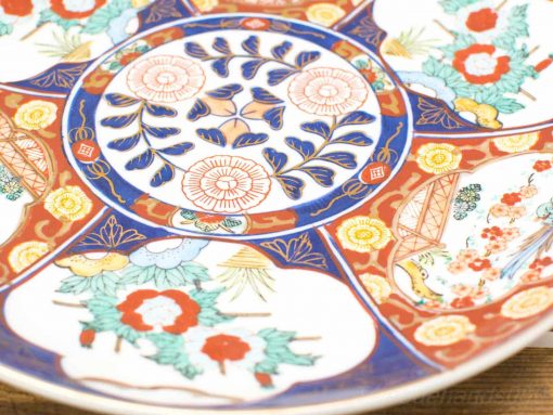 Stunning Japanese Imari ceramic plate with vibrant floral pattern and intricate design.
