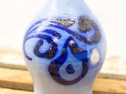 Elegant blue-glazed ceramic vase with intricate patterns, perfect for decoration and gifts.