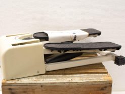Vintage cream sustain pedal for musicians, enhancing performance with grip and spring-loaded action.