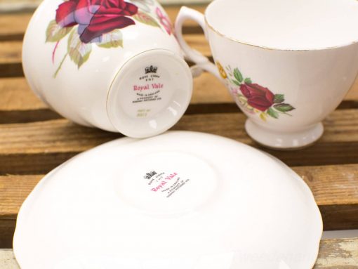 Elegant Royal Vale porcelain tea set with intricate floral designs and gold accents.