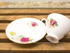 Elegant floral porcelain tea set with gold rim, perfect for special occasions or decor.