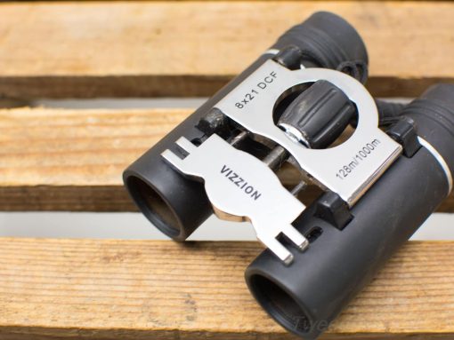 Vizzion 8x21 compact binoculars for outdoor adventures, perfect for birdwatching and sporting events.