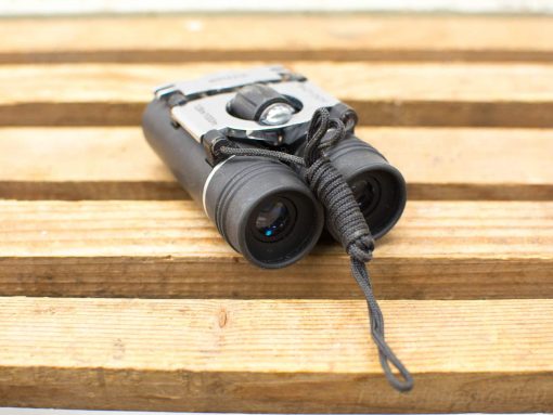Compact 8x21 binoculars with durable grip for outdoor adventures like birdwatching and hiking.