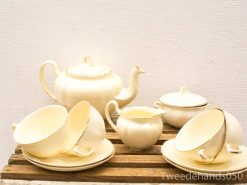 Vintage cream tea set with elegant gold edges, perfect for sophisticated afternoon tea gatherings.