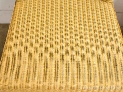 Comfortable woven rattan chair seat in warm golden-brown, perfect for any space.