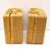 Handwoven light brown baskets with bamboo handles, perfect for storage and decoration.