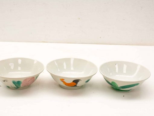 Charming vintage ceramic bowls featuring floral, rooster, and leaf designs for decorative or serving use.