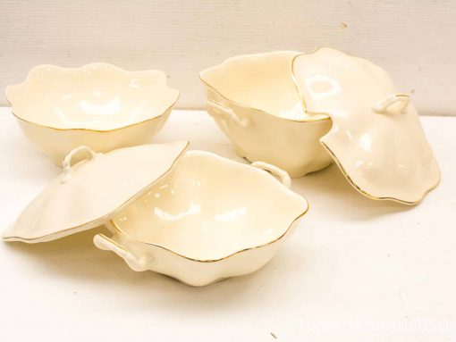 Elegant cream bowls with gold trim, perfect for any dining occasion or special meals.