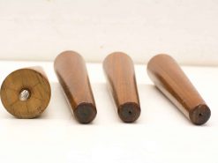 Elegant vintage set of four tapered wooden objects, showcasing exquisite craftsmanship and rich grain patterns.