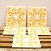 Vintage decorative tiles with floral designs for a warm and inviting home decor.