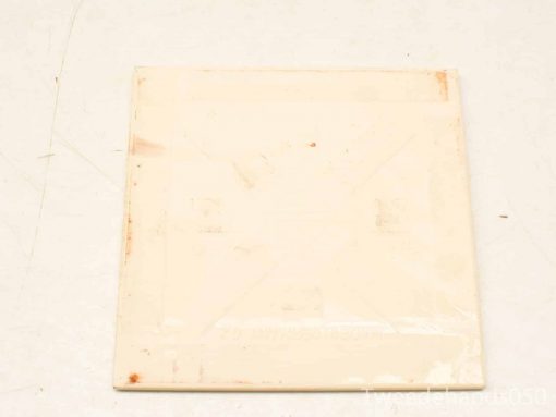 Glossy vintage white tile with subtle wear, ideal for versatile interior design applications.