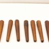 Set of eight vintage wooden tapered legs, perfect for adding rustic charm to furniture.