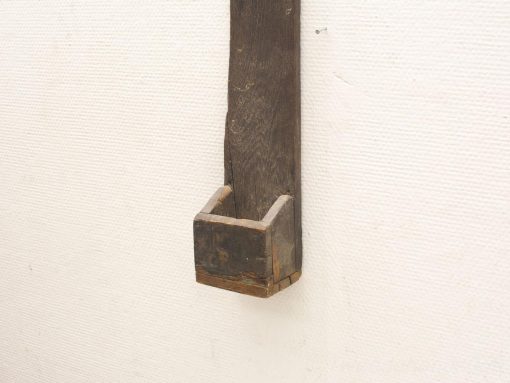 Rustic wooden wall shelf with open storage box for organizing small items and decor.