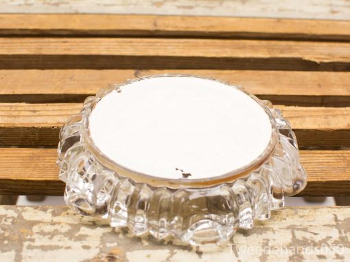 Elegant vintage glass bowl with scalloped edges, perfect for decor or serving.
