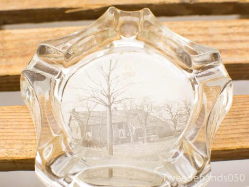 Vintage glass dish featuring an etched landscape scene, perfect for collectors and home decor.