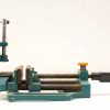 Robust teal hand clamp for woodworking and metalworking projects, featuring adjustable grip and durable construction.