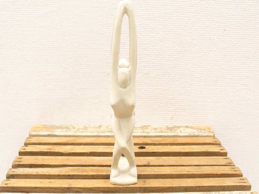 Elegant white female figure sculpture, showcasing beauty and serenity in minimalist design.