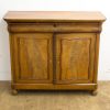 Elegant vintage wooden cabinet with sculpted doors and polished finish for stylish storage.