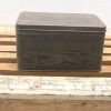 Antique engraved tin box featuring a serene landscape, perfect for decor or storage.
