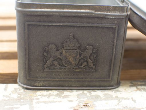Vintage Groningen tin with heraldic emblem, showcasing unique antique charm and historical significance.